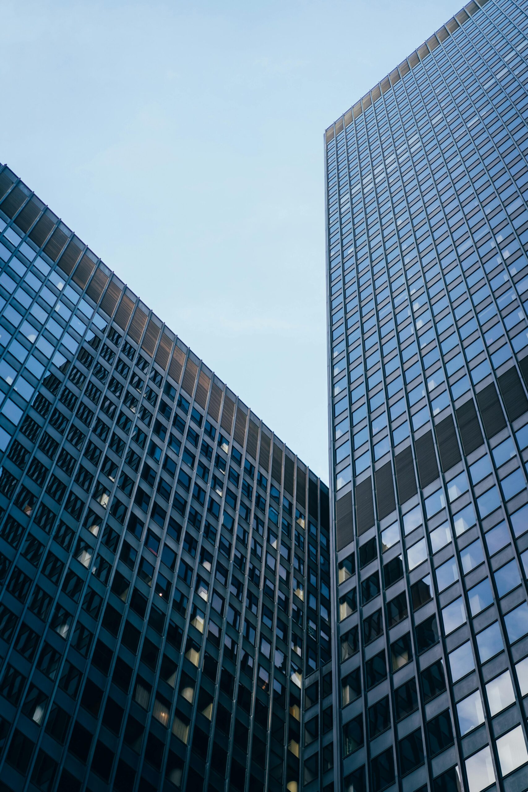 Low angle view of modern skyscrapers in Chicago, showcasing urban architecture.